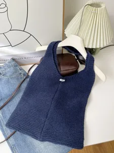 Large capacity navy blue knitted tote bag for women in a casual lifestyle setting