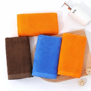 High-quality soft absorbent pure cotton towels set in vibrant orange, blue and brown colors