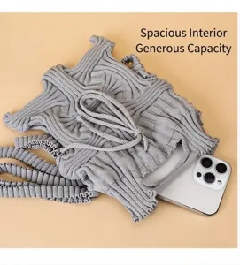 Detail view of grey pleated knitted crossbody bag showing spacious interior for phone