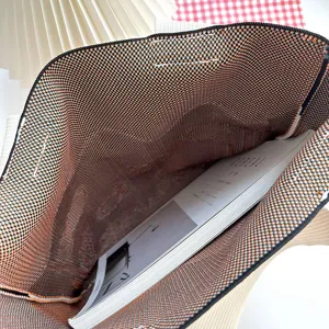 Interior view of a cartoon octopus knitted shoulder bag showing spacious capacity