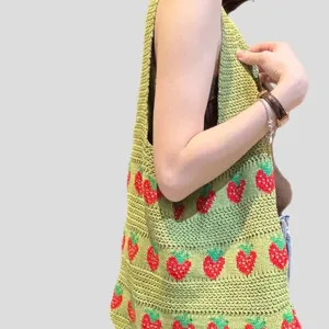 Handmade green crochet tote bag with red strawberry patterns for women