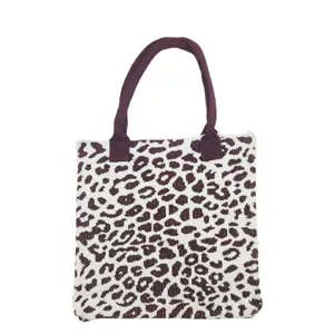 Detailed view of the high quality knitted fabric and leopard print on this tote bag