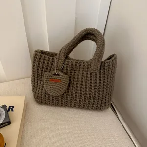 Detailed view of a handmade chunky knit cotton woven handbag in vintage brown