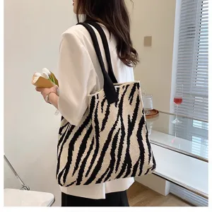 Fashionable zebra stripe knitted tote bag with large capacity and stylish lifestyle presentation