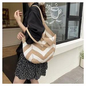 Close-up of stylish large capacity crochet shoulder bag with khaki and white chevron