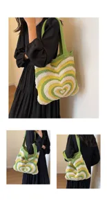 Women knit shoulder bag with cute heart wave pattern, stylish casual tote shopping bag detail view.