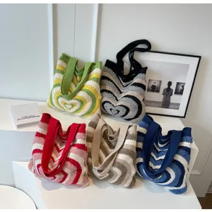 Stylish women knitted tote bag with heart wave pattern and large capacity shoulder bag design.