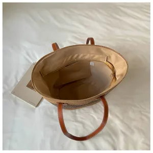 Detailed interior view of a large capacity straw woven beach tote bag for women