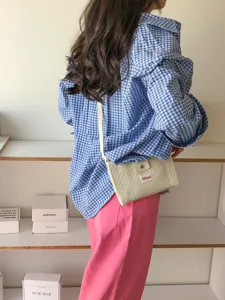 Detailed view of casual crossbody phone bag with quilted design and strap for women summer daily use.
