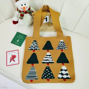 Knitted yellow tote bag with festive Christmas tree patterns for holiday shopping