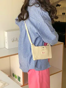 Quilted crossbody bag for women, cute casual mini shoulder phone bag for daily travel and shopping.