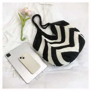 Stylish black and white chevron knit shoulder bag featuring a large capacity design