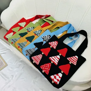 Selection of colorful knitted shoulder bags with varied Christmas tree pattern designs