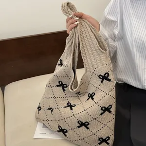 Large capacity knitted tote bag with black bow patterns and diamond weave design