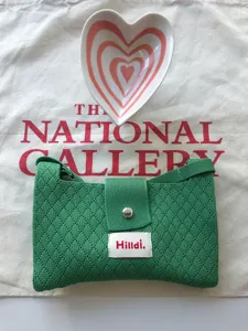 Green knit crossbody bag for women, cute summer casual shoulder purse with flap and snap.