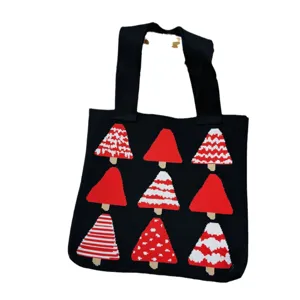 Black knitted tote bag featuring festive red and white Christmas tree patterns for women