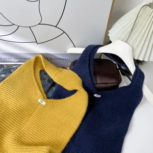 Large capacity minimalist knitted shoulder bag for women in yellow and navy blue colors.