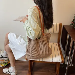 Handmade crochet woven shoulder bag for beach vacations with stylish leather straps