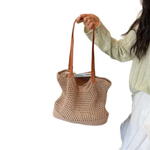 Minimalist handmade hollow woven cotton straw tote bag for beach vacation and casual use.
