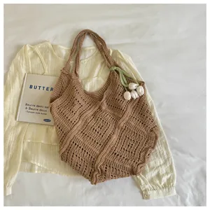 Bohemian brown crochet tote bag with hollow knit design and white tulip ornament detail