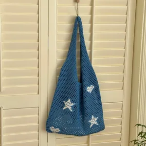 Blue hollow-out knitted tote bag with white star and heart patterns for summer vacation