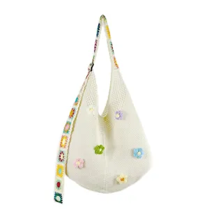 Casual knit shoulder bag with colorful floral crochet accents, large capacity hobo bag style for daily wear.