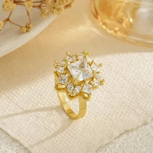 Close-up of a sparkling gold-plated snowflake ring with clear cubic zirconia