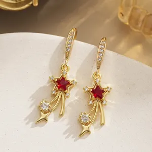 Vintage gold dangle earrings with red star zircon and sparkling shooting star accents