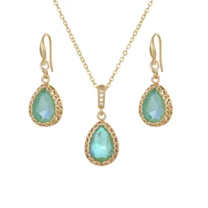 Elegant bridal jewelry set featuring teardrop blue gemstones and zircon pendant necklace