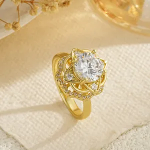 Detailed view of elegant gold flower spinning ring with sparkling crystal stone