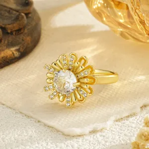 Close-up of golden sunflower rotating ring with sparkling center zirconia stone
