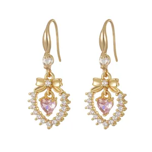 Elegant gold-plated bow earrings featuring a sparkling pink heart-shaped zircon drop.