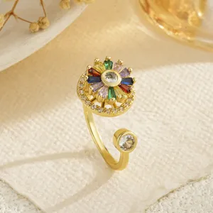 Macro detail of a rotatable gold-plated flower ring inlaid with vibrant colorful zircons
