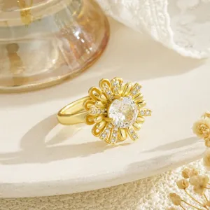 Detailed close-up of a luxury gold spinning flower ring with sparkling crystals