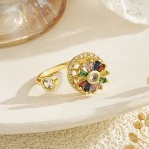 Close-up of rotatable golden ring featuring colorful zircon flower and open band design