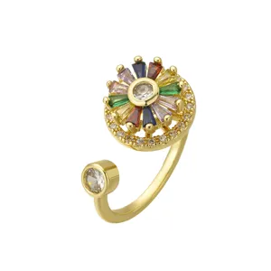 Rotating gold-plated flower ring with rainbow baguette zircons and clear crystal