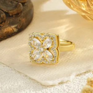 Detailed view of rotating gold clover ring with marquise-cut cubic zirconia petals