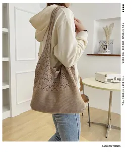 Lifestyle view of a large hollow-knit shoulder bag in a minimalist setting