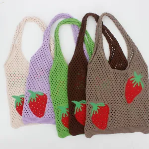 Variety of knit mesh strawberry tote bags in multiple pastel colors shown together