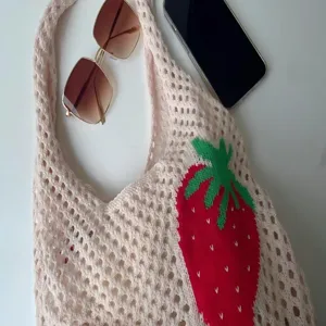 Eco-friendly knitted mesh tote bag featuring a cute strawberry pattern and hollow-out design