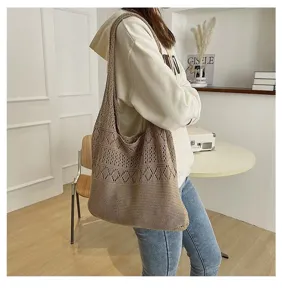 Stylish woman wearing a brown hollow-out knitted tote bag in a cozy lifestyle setting