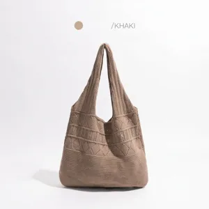 Detail view of the khaki hollow knit tote bag showing the texture