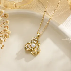 Elegant close-up detail of a golden flower pendant necklace with crystal and pearl inlay