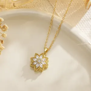 Detailed view of a rotatable gold flower fidget necklace with sparkling crystals.