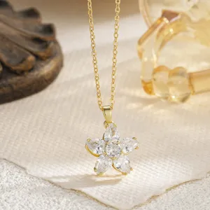 Detailed macro view of a stunning five-petal clear crystal flower pendant necklace