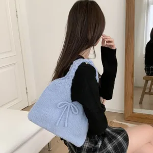 Cute light blue knitted handbag with bow detail for women's autumn winter fashion