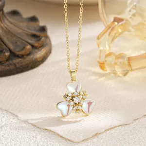Close-up of golden rotating star pendant necklace with zircons and enamel inserts