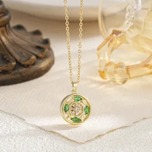 Vintage rotating flower pendant necklace with green crystals on fine gold chain