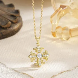 Detailed close-up of gold plated star pendant necklace with sparkling clear cubic zirconia stones