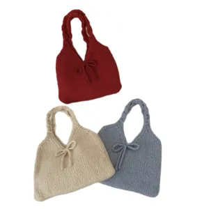 Set of three cute knitted bow handbags in red beige and blue for autumn winter fashion